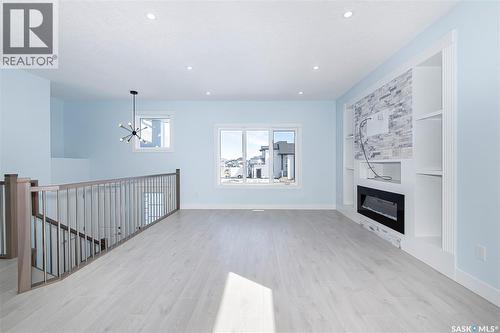 906 Bentley Manor, Saskatoon, SK - Indoor Photo Showing Living Room With Fireplace