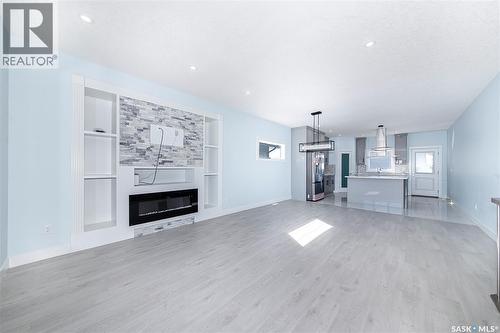 906 Bentley Manor, Saskatoon, SK - Indoor Photo Showing Living Room With Fireplace