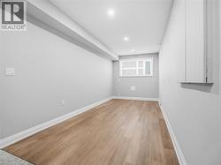 Unfurnished room featuring light wood-style floors and recessed lighting - 