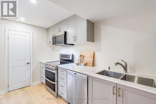 27 Marks Road, Springwater, ON - Indoor Photo Showing Kitchen With Double Sink
