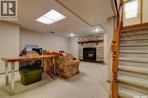 31 Crossley Bay, Regina, SK - Indoor Photo Showing Other Room With Fireplace