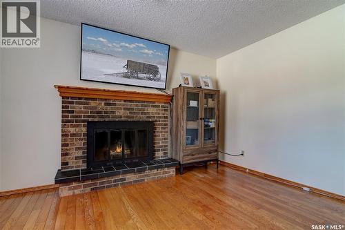 31 Crossley Bay, Regina, SK - Indoor Photo Showing Living Room With Fireplace