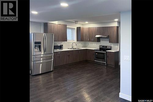 3234 37Th Street W, Saskatoon, SK - Indoor Photo Showing Kitchen With Double Sink