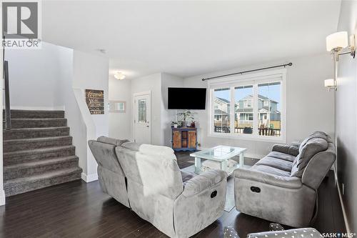 338 Rosewood Boulevard W, Saskatoon, SK - Indoor Photo Showing Living Room With Fireplace