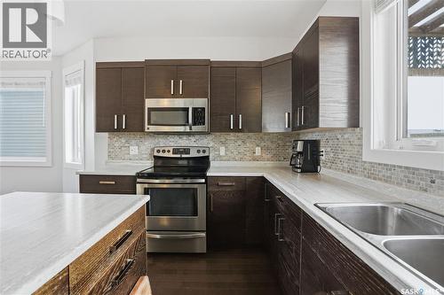 338 Rosewood Boulevard W, Saskatoon, SK - Indoor Photo Showing Kitchen With Double Sink With Upgraded Kitchen
