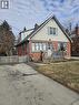 Bungalow-style home featuring brick siding and a chimney - 1154 Queens Boulevard, Kitchener, ON  - Outdoor 