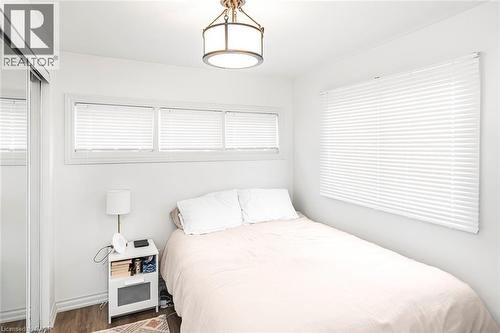 Bedroom featuring a closet and wood finished floors - 57 New Street, Hamilton, ON - Indoor Photo Showing Bedroom