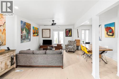 Living room with a ceiling fan, light wood-type flooring, and recessed lighting - 57 New Street, Hamilton, ON - Indoor Photo Showing Living Room