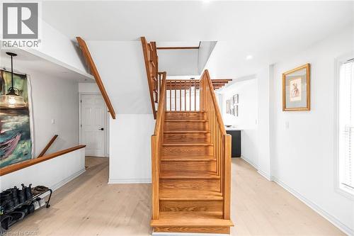 Stairs with hardwood / wood-style flooring and recessed lighting - 57 New Street, Hamilton, ON - Indoor Photo Showing Other Room