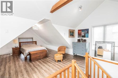 Bedroom with lofted ceiling with beams and wood finished floors - 57 New Street, Hamilton, ON - Indoor Photo Showing Other Room