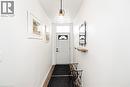 Entryway featuring baseboards and wood finished floors - 57 New Street, Hamilton, ON  - Indoor Photo Showing Other Room 