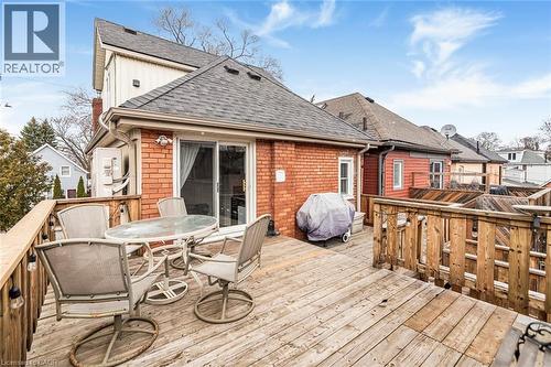 Wooden deck with outdoor dining area and a grill - 57 New Street, Hamilton, ON - Outdoor With Deck Patio Veranda