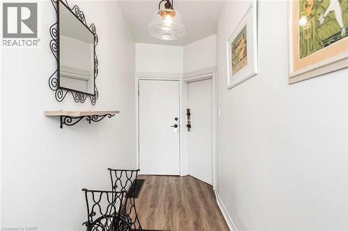 Doorway featuring wood finished floors - 57 New Street, Hamilton, ON - Indoor Photo Showing Other Room