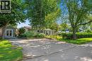 Single story home with french doors and a front yard - 181 Cedar Drive, Turkey Point, ON  - Outdoor 