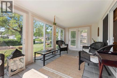 Sunroom featuring french doors, healthy amount of natural light, and tile patterned flooring - 181 Cedar Drive, Turkey Point, ON - Indoor