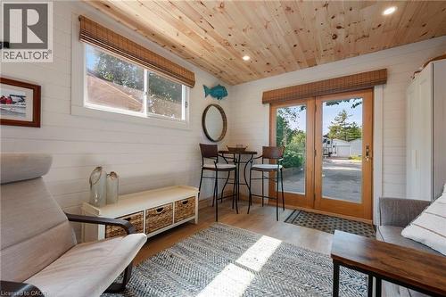 Doorway featuring wood ceiling, wood walls, recessed lighting, and wood finished floors - 181 Cedar Drive, Turkey Point, ON - Indoor Photo Showing Other Room