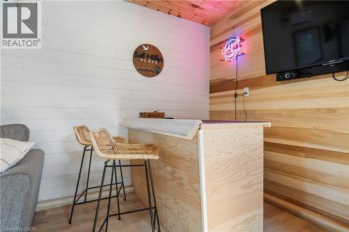 Bar area with wood walls, wood finished floors, and wooden ceiling - 181 Cedar Drive, Turkey Point, ON - Indoor Photo Showing Other Room