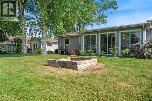 Rear view of house with an outdoor fire pit - 181 Cedar Drive, Turkey Point, ON - Outdoor