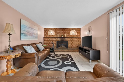 15 Fairington Crescent, Hamilton, ON - Indoor Photo Showing Living Room With Fireplace