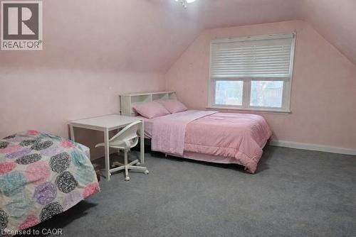 Bedroom with carpet flooring and a ceiling fan - 226 Auburn Avenue, Hamilton, ON - Indoor Photo Showing Bedroom