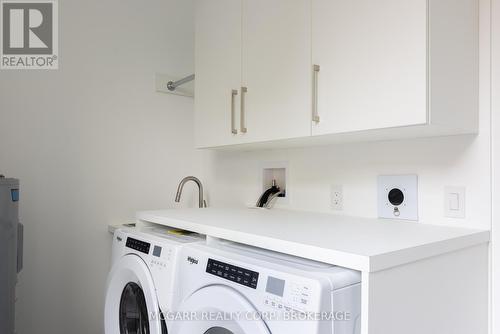 Lundry room with sink + appliances - 401 - 77 Yates Street, St. Catharines (Downtown), ON - Indoor Photo Showing Laundry Room