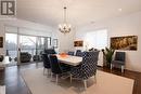 Dining area opening to sunset facing balcony - 401 - 77 Yates Street, St. Catharines (Downtown), ON  - Indoor Photo Showing Dining Room 