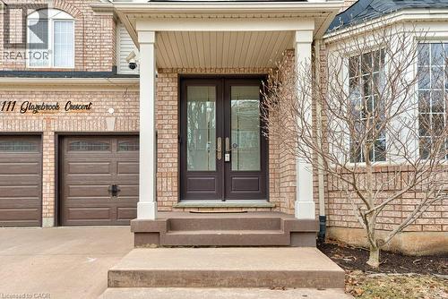 Entrance to property with brick siding, french doors, a garage, and driveway - 111 Glazebrook Crescent, Cambridge, ON - Outdoor
