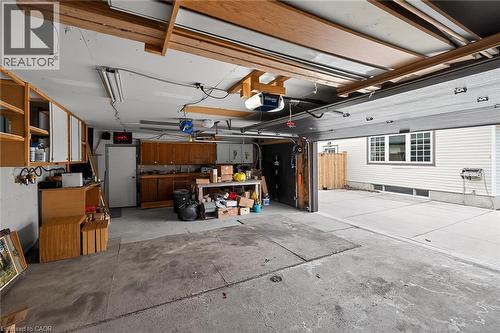Garage featuring a garage door opener - 19 Burfield Avenue, Hamilton, ON - Indoor Photo Showing Garage
