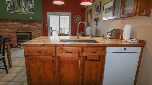829-880 Northstar Drive, Kimberley, BC - Indoor Photo Showing Kitchen With Fireplace With Double Sink