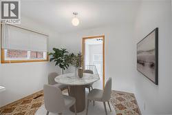 Living area featuring light wood-type flooring and a textured ceiling (virtually staged) - 