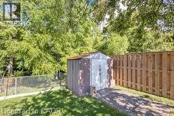 View of shed with a fenced backyard - 