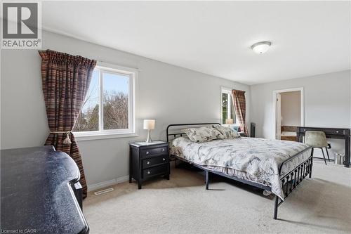 Carpeted bedroom with multiple windows - 84 Duncairn Crescent, Hamilton, ON - Indoor Photo Showing Bedroom