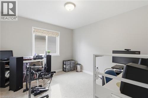 Office area featuring light colored carpet and baseboards - 84 Duncairn Crescent, Hamilton, ON - Indoor