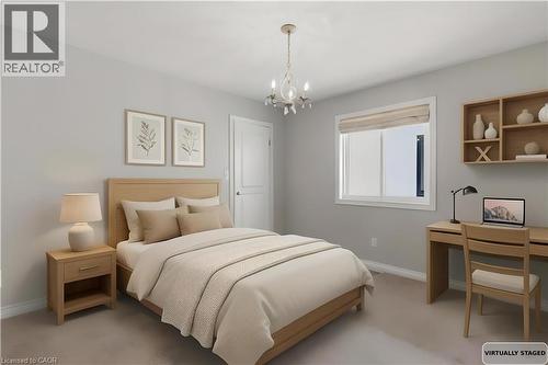 Bedroom featuring hanging lights, an office area, and light colored carpet - 84 Duncairn Crescent, Hamilton, ON - Indoor Photo Showing Bedroom