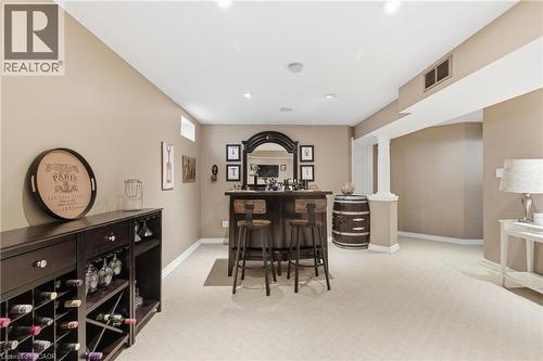 Dining area with a dry bar and light colored carpet - 84 Duncairn Crescent, Hamilton, ON - Indoor