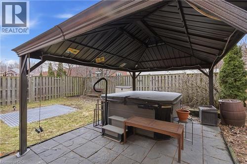 Fenced backyard with a gazebo, a patio, and a hot tub - 84 Duncairn Crescent, Hamilton, ON - Outdoor With Exterior