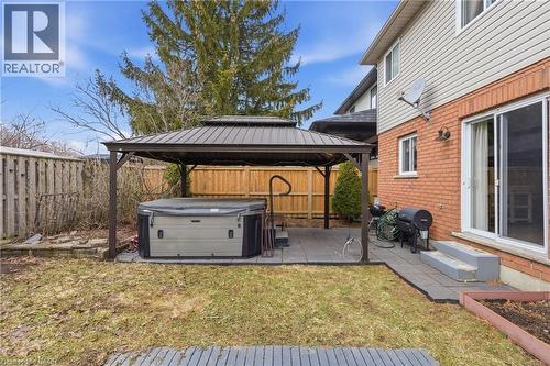 Wooden terrace with a gazebo, grilling area, a patio, and a fenced backyard - 84 Duncairn Crescent, Hamilton, ON - Outdoor With Exterior