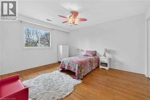 Bedroom featuring light wood-style floors and ceiling fan - 22 Woodside Drive, Hamilton, ON - Indoor Photo Showing Bedroom