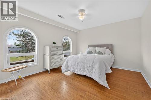 Bedroom with light wood finished floors and a ceiling fan - 22 Woodside Drive, Hamilton, ON - Indoor Photo Showing Bedroom