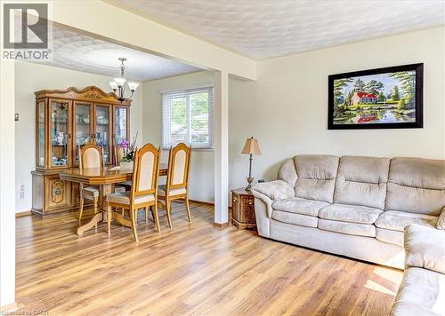 Open concept living and dining rooms. - 12 Miller Crescent, Simcoe, ON - Indoor Photo Showing Living Room