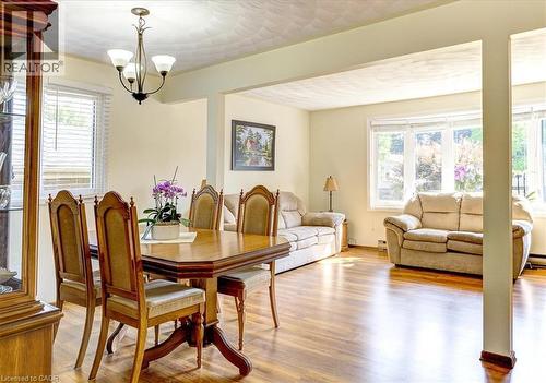 Dining and living rooms have laminate flooring. - 12 Miller Crescent, Simcoe, ON - Indoor Photo Showing Dining Room