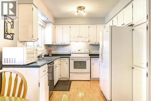 Classic U shape for easy access to cupboards and appliances. - 12 Miller Crescent, Simcoe, ON - Indoor Photo Showing Kitchen