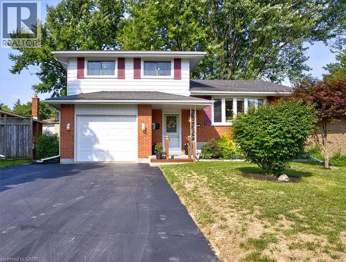 Attached 1 car garage with inside access door to home. - 12 Miller Crescent, Simcoe, ON - Outdoor With Facade