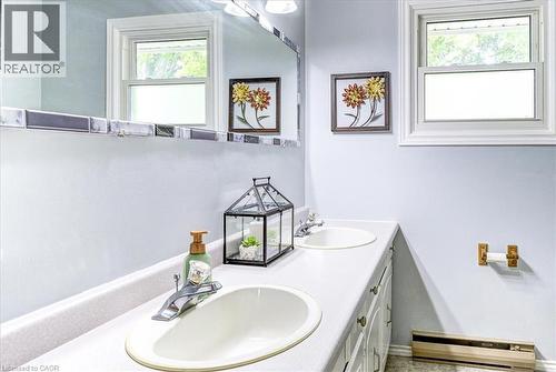 Double sinks making the morning rush a little more convenient. - 12 Miller Crescent, Simcoe, ON - Indoor Photo Showing Bathroom