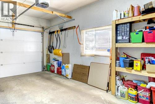 Single car garage with insulated door. - 12 Miller Crescent, Simcoe, ON - Indoor Photo Showing Garage