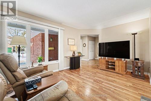 Living room towards foyer and porch - 90 Moresby Drive, Ottawa, ON - Indoor Photo Showing Living Room