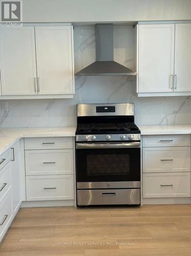 Upgraded kitchen with quartz countertops - 2432 Marisa Court, Mississauga, ON - Indoor Photo Showing Kitchen