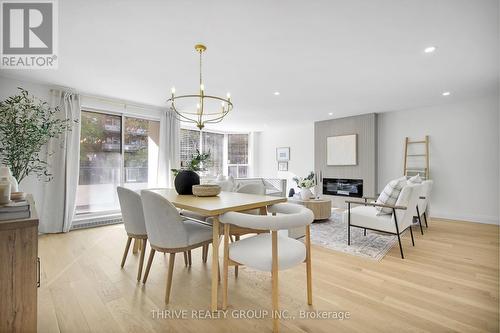 105 - 1180 Commissioners Road W, London South (South B), ON - Indoor Photo Showing Dining Room With Fireplace