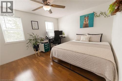 Bedroom featuring wood finished floors, ceiling fan, and a textured ceiling - 988 Prosperity Court, London, ON - Indoor Photo Showing Bedroom