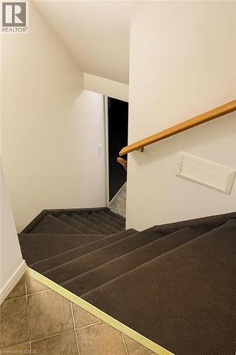 Stairway with tile patterned floors and baseboards - 988 Prosperity Court, London, ON - Indoor Photo Showing Other Room